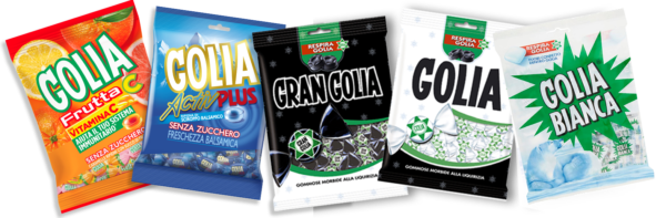 An array of Golia candies is showcased, highlighting the Natural Licorice Juice variety. The collection includes Golia Frutta C, Golia Activ Plus, Gran Golia, Golia, and Golia Bianca presented in an eye-catching 18x180g case with unique designs and colors.