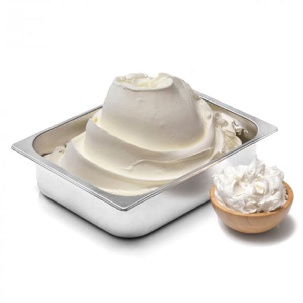 A metal container filled with a large, swirled serving of soft serve gelato. Beside it, there is a small, wooden bowl also containing a serving of Elenka Sole Soft Serve Gelato Mix 400, with both servings displaying a smooth, creamy texture.