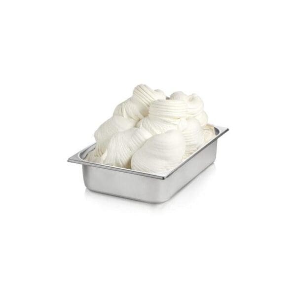 A stainless steel container filled with creamy, swirled white soft serve ice cream sits against a white background. The texture of the ice cream appears smooth and fluffy with neatly arranged peaks, thanks to the Elenka Yogurt Powder for Gelato, Soft Serve & Slush used in its preparation.