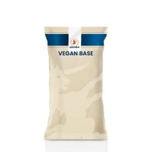 A beige and blue bag labeled “VEGAN BASE” with a small circular logo at the top that includes a lion. The bag appears sealed and upright on a white background.