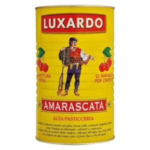 A yellow can labeled “Luxardo Amarascata” with an illustration of a man in traditional attire holding cherries, and red cherries on each side. Text is in Italian, and the can is used for pastry and confectionery.
