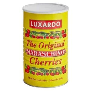A yellow can of Luxardo The Original Maraschino Cherries, featuring red letters and cherry illustrations. The label states it’s ideal for cocktails and made in Italy.