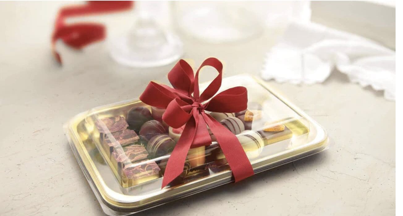 Chocolate gift tray with red ribbon bow