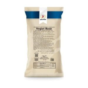 A 1kg beige bag of Elenka Vegan Base mix with a blue stripe at the top, nutrition facts, and product text on the front. The packaging is upright against a white background.